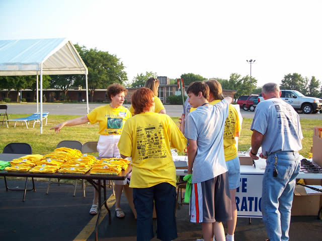 Race volunteers set up for race day registration and check-in