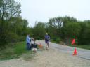 Station volunteer Mary Hopper watches veteran runner Tom Bunk of North Prairie, WI