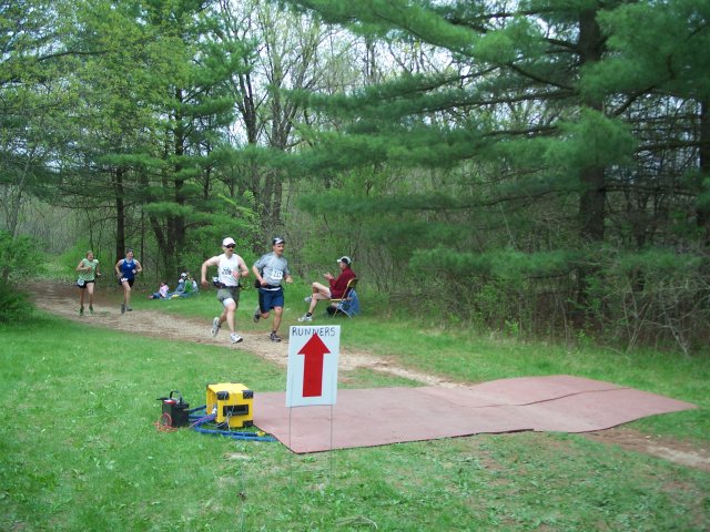 Andrew Starsky and Paul Sherman lead Kami Holtz and Pam Nielsen to the finish chute