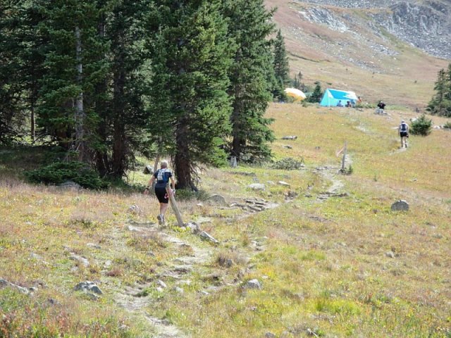 Jane leading Michael to the aid station at Hope Pass