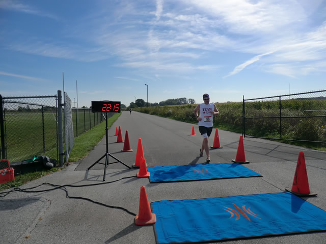 Top participants make their finish line in the inaugural Hoosier Burn Camp 5K Run