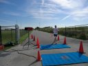 Top participants make their finish line in the inaugural Hoosier Burn Camp 5K Run