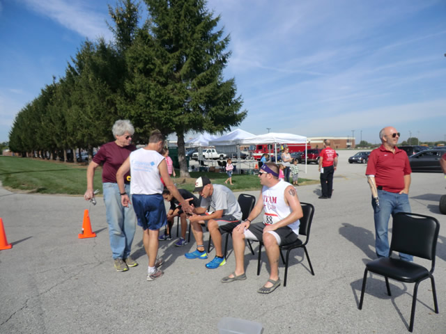 Top participants make their finish line in the inaugural Hoosier Burn Camp 5K Run