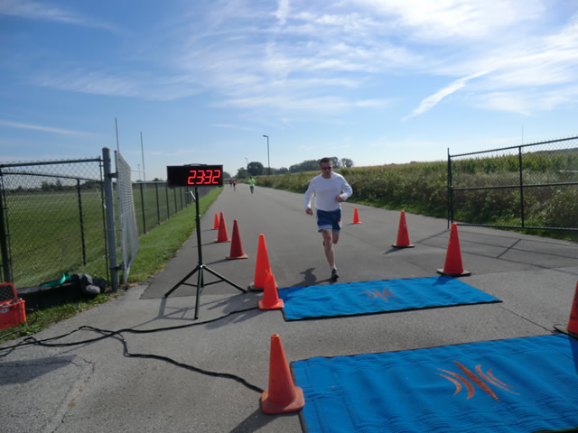 Top participants make their finish line in the inaugural Hoosier Burn Camp 5K Run