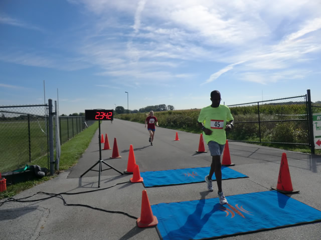 Top participants make their finish line in the inaugural Hoosier Burn Camp 5K Run