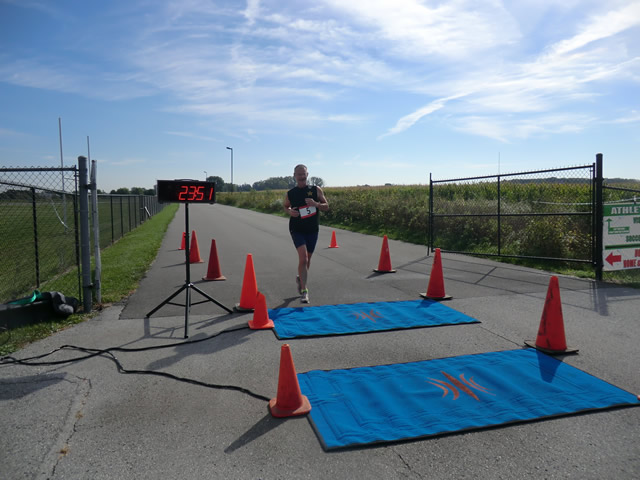 Top participants make their finish line in the inaugural Hoosier Burn Camp 5K Run