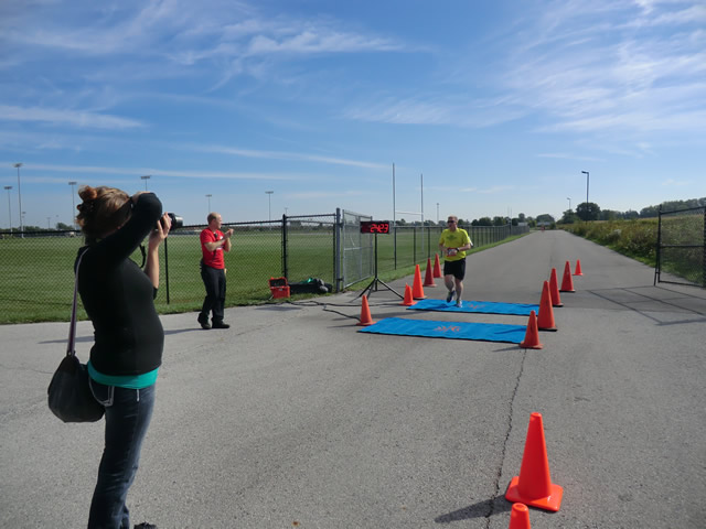 Top participants make their finish line in the inaugural Hoosier Burn Camp 5K Run