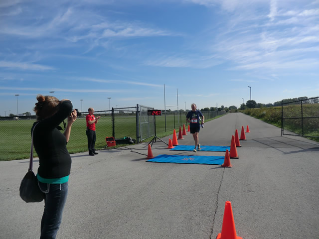 Top participants make their finish line in the inaugural Hoosier Burn Camp 5K Run