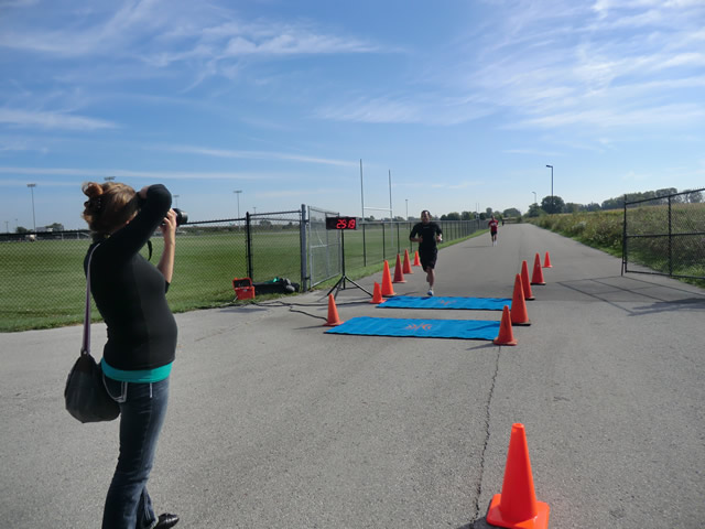 Top participants make their finish line in the inaugural Hoosier Burn Camp 5K Run