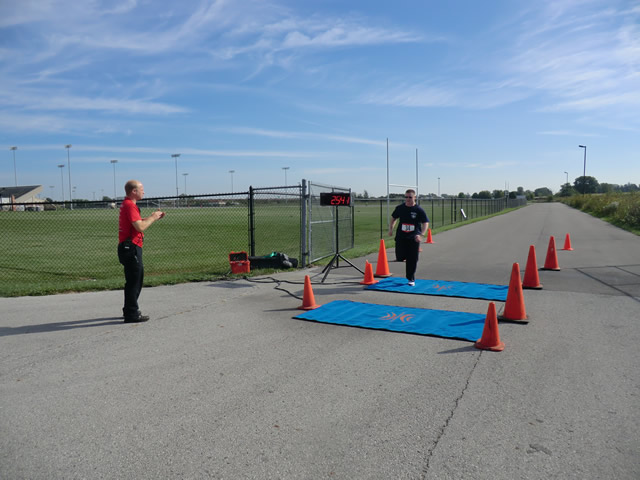 Top participants make their finish line in the inaugural Hoosier Burn Camp 5K Run