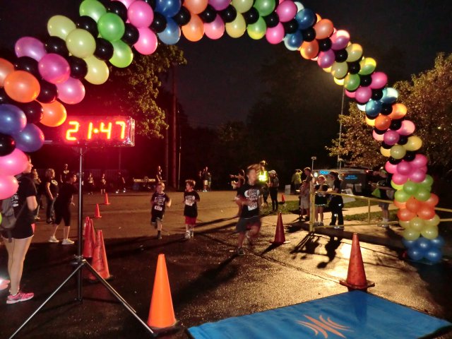 Top participants make their finish line in the inaugural MSW Light Up the Night 5k!