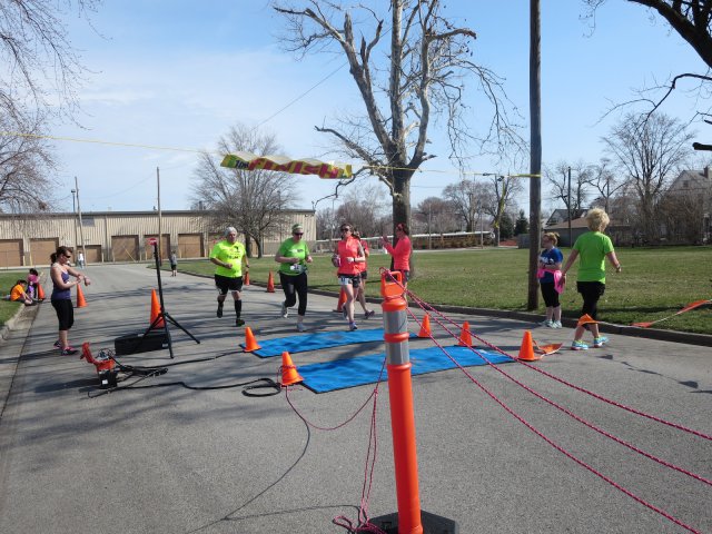 A finish area scene as it happened in Hammond at the 10k/5k Charity Run.