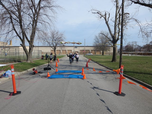 A finish area scene as it happened in Hammond at the 10k/5k Charity Run.
