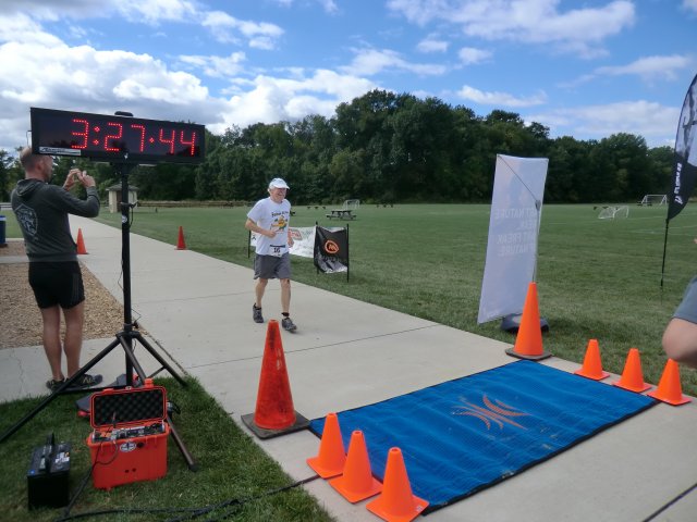 Raucous Applause Greets Final Finisher, Scott Rains, 75 of Portage, Indiana!