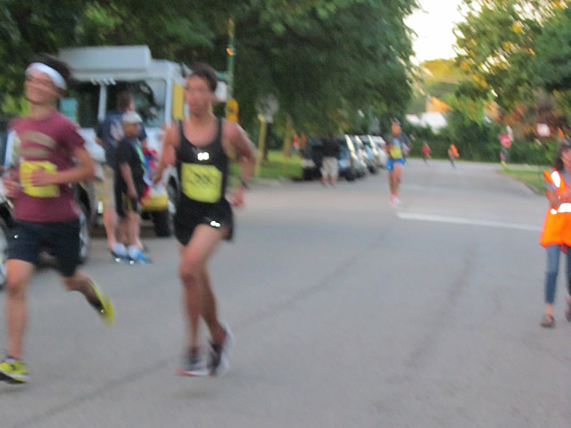 5-Km runners complete their first lap on course