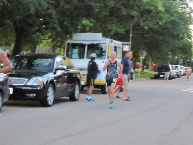 5-Km runners complete their first lap on course
