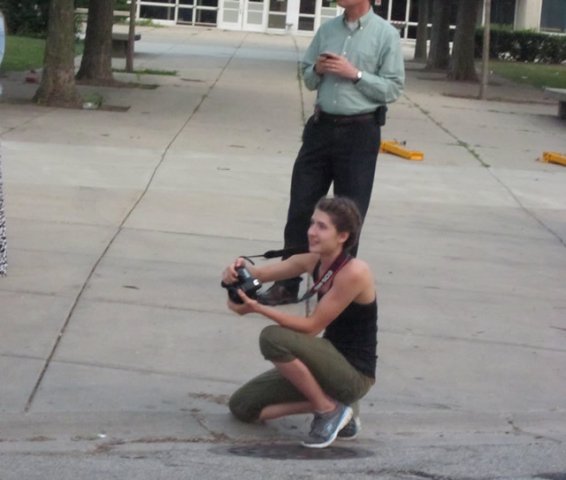 Monica snaps photos as runners hit the finish line