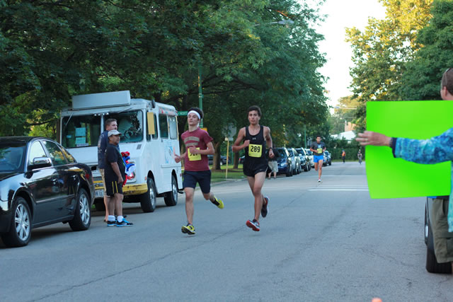 5-Km runners complete their first lap on course