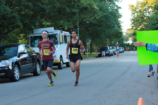 5-Km runners complete their first lap on course