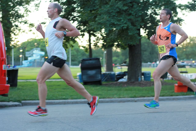 5-Km runners complete their first lap on course