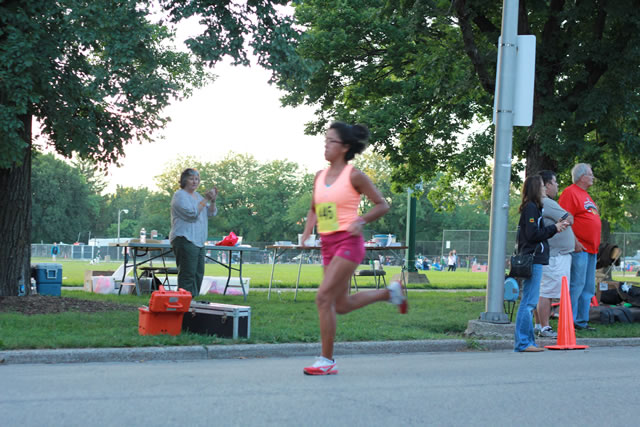 5-Km runners complete their first lap on course