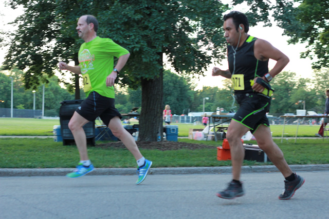 5-Km runners complete their first lap on course