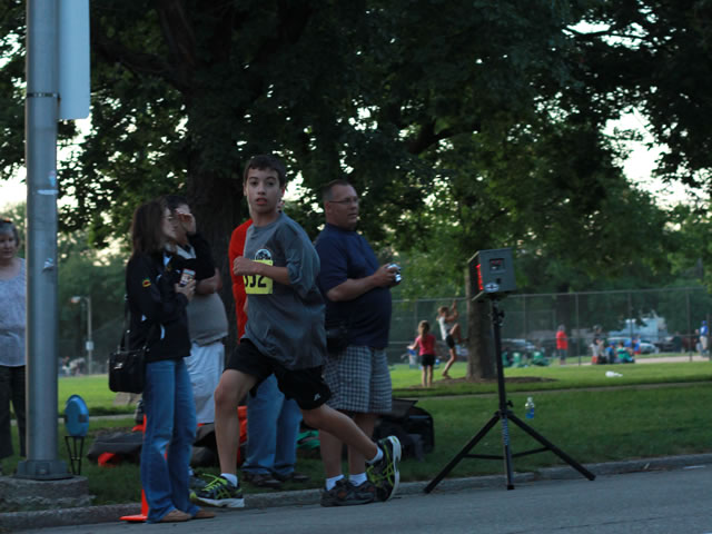 5-Km runners complete their first lap on course