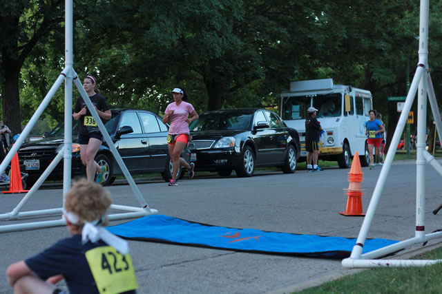 5-Km runners complete their first lap on course