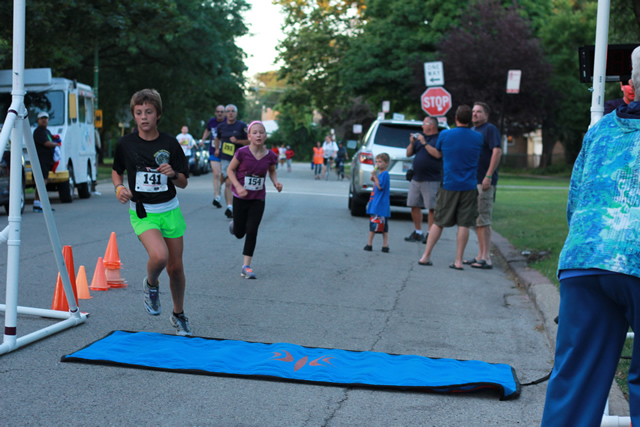 Evie finishes her first-ever race... 1-Mile Lunar Orbit