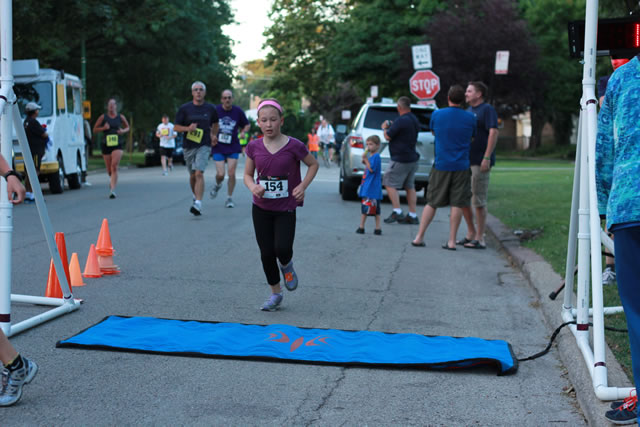 Evie finishes her first-ever race... 1-Mile Lunar Orbit