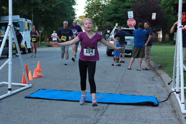 Evie finishes her first-ever race... 1-Mile Lunar Orbit