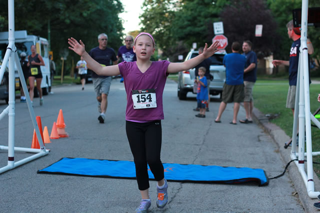 Evie finishes her first-ever race... 1-Mile Lunar Orbit