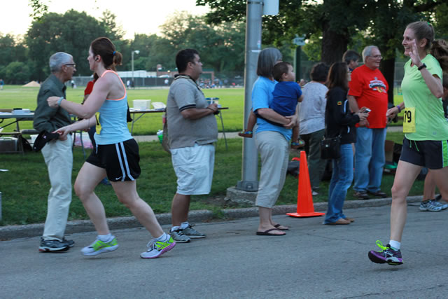 5-Km runners complete their first lap on course