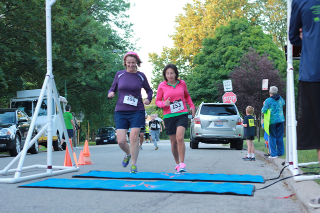 After orbiting our Full Moon course 1-mile runners make thier finish line