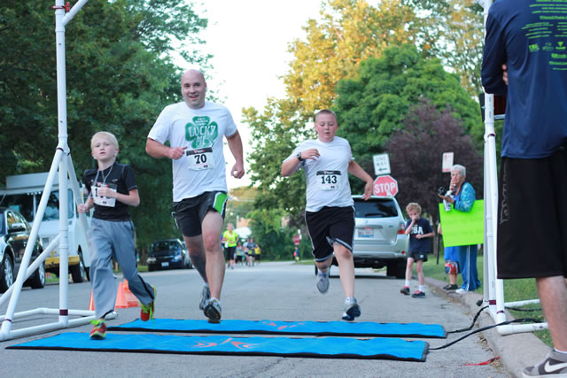 After orbiting our Full Moon course 1-mile runners make thier finish line
