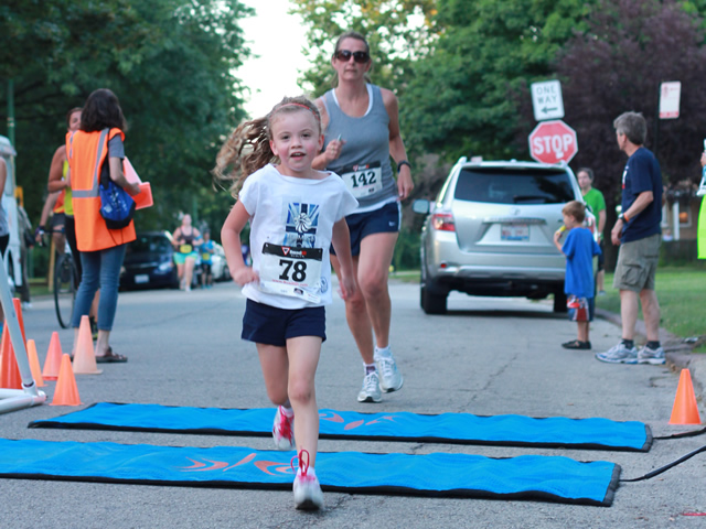 After orbiting our Full Moon course 1-mile runners make thier finish line