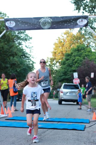 After orbiting our Full Moon course 1-mile runners make thier finish line