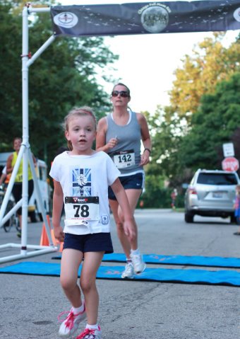 After orbiting our Full Moon course 1-mile runners make thier finish line