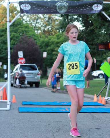 After orbiting our Full Moon course 1-mile runners make thier finish line