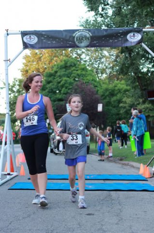 After orbiting our Full Moon course 1-mile runners make thier finish line