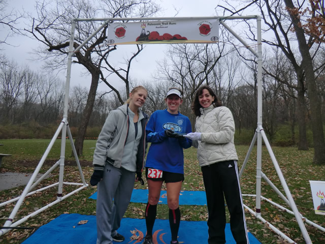 Shelley Cook (center) of Waukegan earns first place fmale overall in the Paleo-Carb 50-Km!