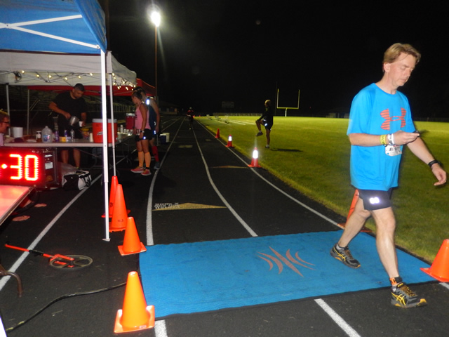 3:30 am... with runners orbiting the track at wildly varying speeds.