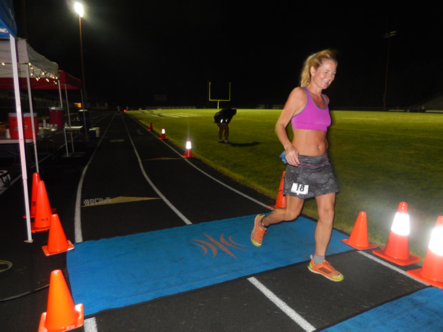 3:30 am... with runners orbiting the track at wildly varying speeds.