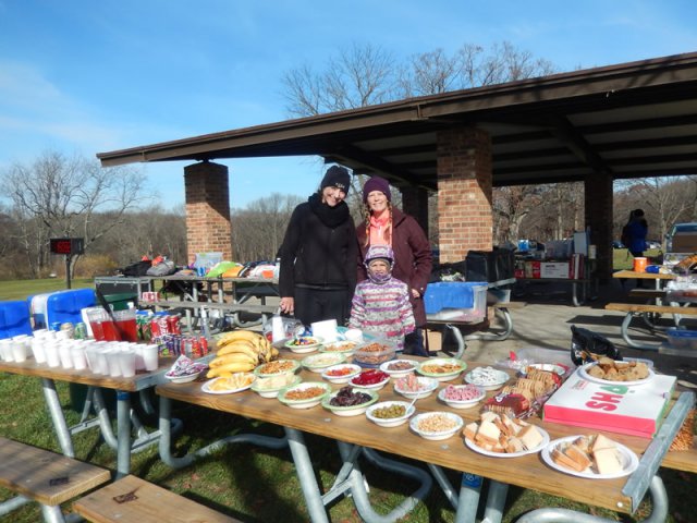 Volunteers, Kelly and Jeni with their Helper at Pioneer Woods Aid Station