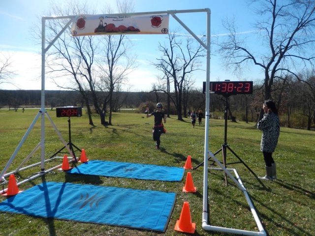 Permian Fall 50-Km runners make their halfway aid station at Pioneer Woods