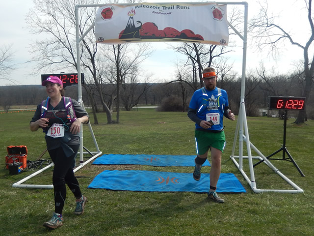Kimmie Brown, veteran of two past Paleozoic Trail Runs, crosses the finish line of Silurian Spring!